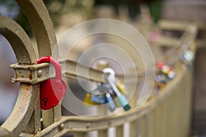 Red lock on a bridge