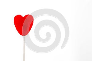 Red lollipop with heart shape isolatedbackground.