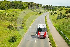 red lorry truck on uk motorway road in england