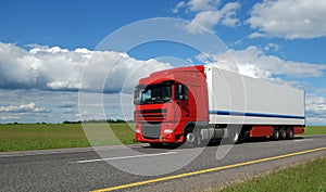 Red lorry with white trailer