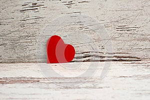 Red Love heart on white-painted wooden texture background