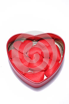 Red love hearts in open tin