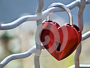 Red love lock in form of a heart