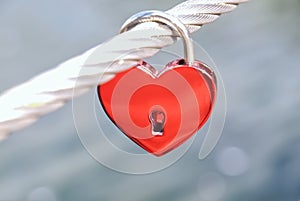 Red love lock in form of a heart