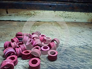 Red LPG gas cylinder rubber isolated on brown background