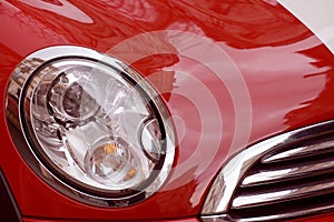 Red luxury car and headlamp photo