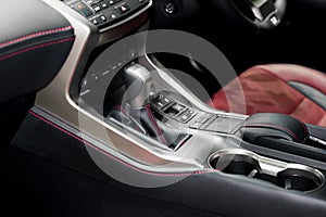 Red luxury car Interior with steering wheel, shift lever and air