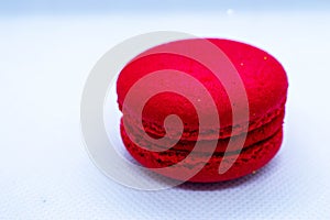 Red Macaroni cookie French on white plate.Close up. Isolated