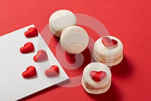 Red Macarons and red shaped hearten an envelope