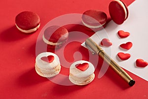 Red Macarons and red shaped hearten an envelope