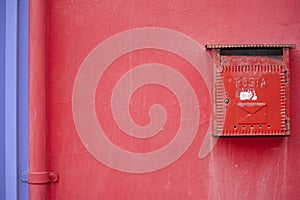 Red mail box.  Red decorative mailbox in the village of Burano in Venetian Lagoon. Colourful post box in Burano, Italy