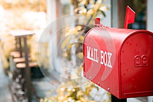 Red mailbox in front of the house