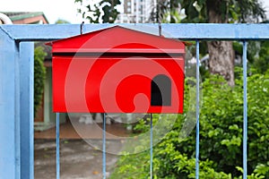 Red mailbox Hanging on the home fence