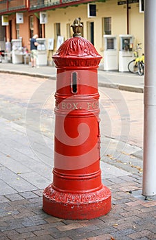 Red mailbox retro on street. Vintage red post