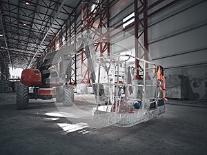 Red man lifting platform machinery at construction site