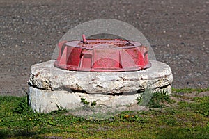Red manhole cover of fire hydrant