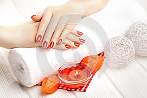 Red manicure with dekor. spa photo