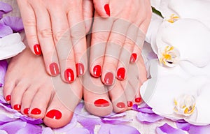 Red manicure and pedicure