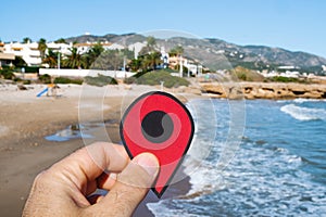 Red marker at del Moro beach in Alcossebre, Spain