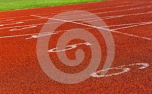 Red markings on the racetrack at the stadium.