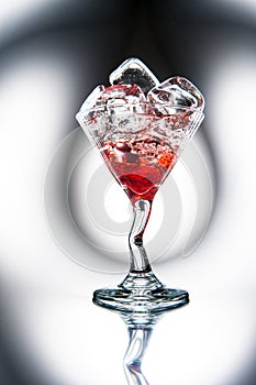 Red Martini (cocktail) with ice cubes