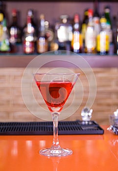 Red martini drink cocktail in a bar