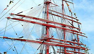 Red masts of a sailing ship
