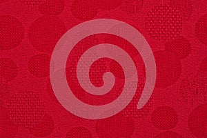 Red material in circles, a background photo