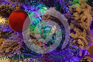 Red matte Christmas ball on the Christmas tree