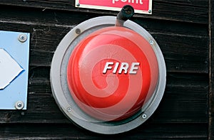 Red mechanical rotary fire alarm bell.