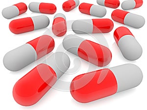 Red medical capsules on white