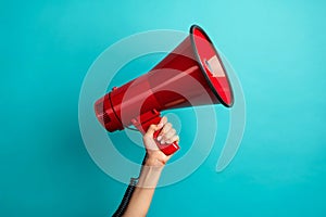 Red Megaphone in Hand on Blue Background
