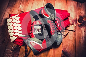 Red men's shoes on a wooden background