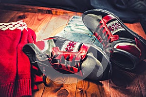 Red men's shoes on a wooden background