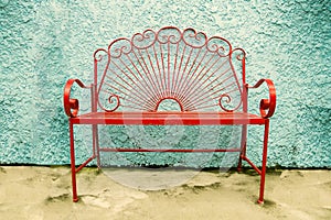 Red metal bench