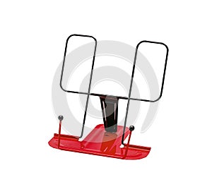 Red metal bookstand, bookend. Isolated photo
