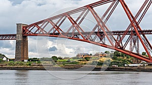 Red metal bridge built many years ago to access the city of Edinburgh, Scotland.