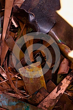 Red metal from copper. remnants of copper processing after punching. Textural background. copper details