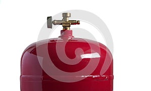 Red metal gas cylinder for LPG with a valve isolated on white background.