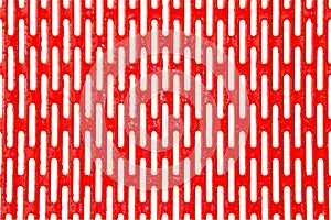 Red metal grille with water drops