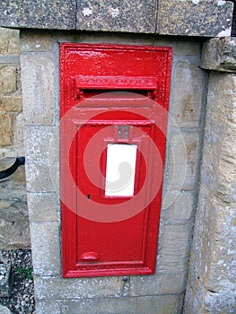 Red metal post box or mail box, London, England