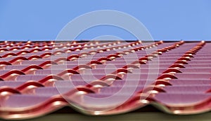 Red metal roof tiles