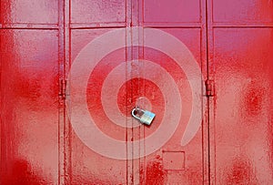 Red metal sheet door was locked with padlock