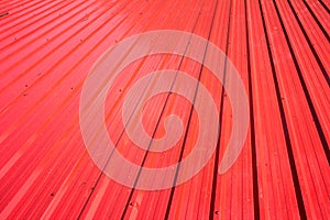 Red metal sheet for industrial building and construction.