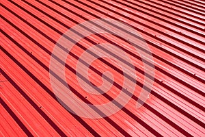 Red metal sheet for industrial building and construction.