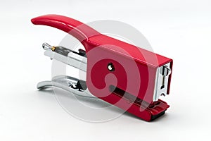 Red metal stapler isolated on white background photo