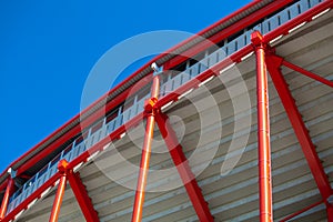 Red metal structure on a background of blue sky