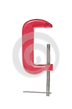 red metal vise isolated on white background. old clamp tool for holding