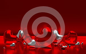 Red metall glossy hearts on red background with reflection effec