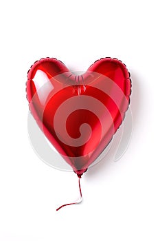 Red metallic foil helium heart shaped balloon over white background. Holidays, love, valentines day, party decoration